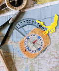 Top Notch High Precision Survival Hiking Compass with bright orange lanyard on a map for camping navigation