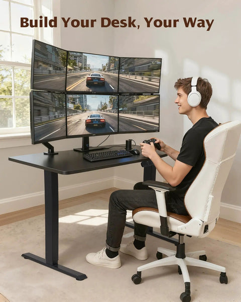 Dual Motor Electric Standing Desk Frame For Your Dope Home Office Setup Height Adjustable Sit Stand Base Fits Table Tops Up To 70.8 By 31.5 Inches 225 Pounds Capacity Black Without Stand showcasing a man gaming at a desk with multiple monitors.