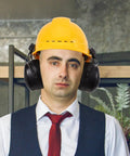 Heavy Duty Earmuffs Built Different Serving Killer Noise Reduction And Hard Hat Compatible Fit with yellow hard hat and formal attire.