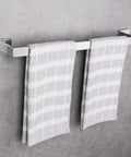 Brushed Nickel Square Bathroom Accessories Set With 24 Inch Towel Bar Wall Mounted on gray wall holding towels