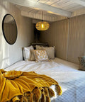 Boho Pendant Light With Plug In Cord And LED Bulb Dimmer Switch 15 Foot Hanging Wicker Rattan Chandelier in cozy bedroom.