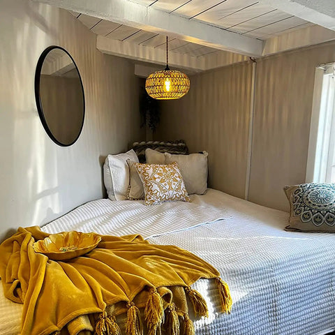 Boho Pendant Light With Plug In Cord And LED Bulb Dimmer Switch 15 Foot Hanging Wicker Rattan Chandelier in cozy bedroom.