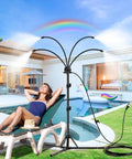 Woman relaxing by pool with Outdoor Standing Misting System With Adjustable Height 5.3 Ft, Foldable Tripod Base For Patio Cooling.