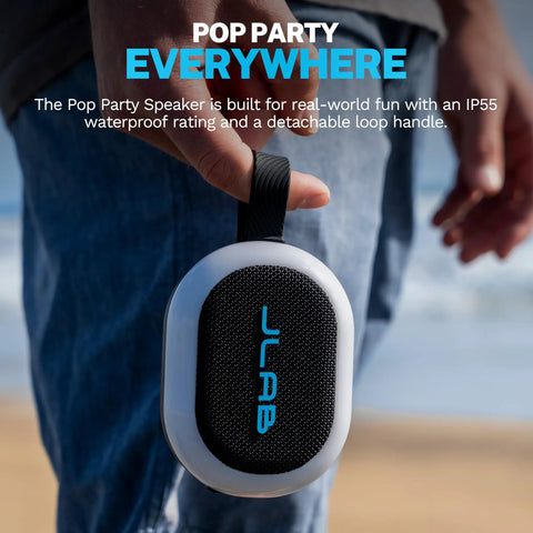 Person holding Portable Bluetooth Speaker Waterproof IP55 With Customizable RGB LED Lights 5W Sound Delivers 8 Plus Hours Playtime For Outdoor Parties Beach Days And Backyard Hangouts by loop handle