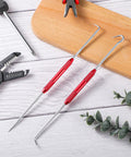 Professional Grade Grip Tight 4 Piece Hook And Pick Tool Set Double Pointed Scribe displayed with red grips and dual tips on a wooden surface.