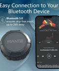 Bluetooth Speaker IPX5 Waterproof Portable Shower Speaker With 12 Hour Battery and Micro SD Playback next to a smartphone