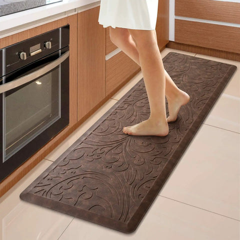 Person standing on Ultra Plush Anti Fatigue Kitchen Mat Cushioned Comfort Rug With Waterproof Non Slip Surface For Standing Long Shifts In The Kitchen And Home Office Ergonomic Support For Sink Laundry And Desk 17.3 Inches Wide By 60 Inches Long Brown