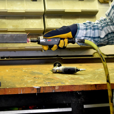 Tough As Nails Straight Pneumatic Die Grinder in use, polished metal surface with sparks, ideal for quick polishing and deburring.
