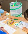 Children using Butterfly Garden Kit With 10 Live Caterpillars, Habitat, Feeder, Chrys-A-Lid Holders, and STEM Activity Journal.