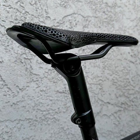 7x10 Seatpost Ear Clamp Titanium Bolt Kit For Oval Carbon Rails installed on a bike, highlighting saddle attachment.