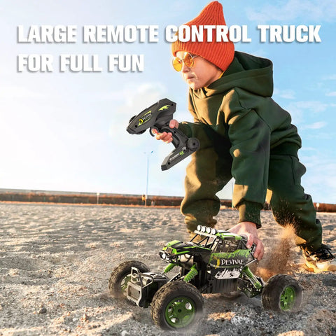 Child playing with All Terrain RC Monster Truck For Kids With Upgraded Lifting Function 2.4GHz on sandy terrain.