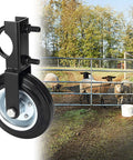 Heavy Duty Gate Wheels That Kill Sag Once And For All Featuring Hella Durable Solid Rubber Tires mounted on a gate with sheep nearby.