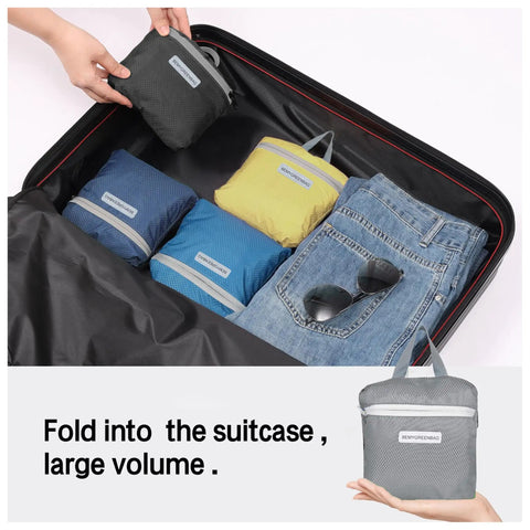 Packing a suitcase with 35L Foldable Waterproof Backpack For Outdoor Adventures, shown in compact form next to folded jeans.