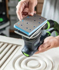 Person using Granat Profile Soft Sanding Sheets 80 By 133 Millimeter with sander on wood contour