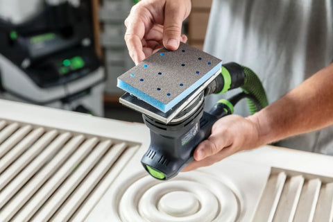 Person using Granat Profile Soft Sanding Sheets 80 By 133 Millimeter with sander on wood contour