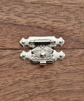 Decorative Jewelry Box Latch With No Sweat Setup For Diy Woodworking, small metal clasp on a wooden surface.