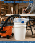 Low-Profile Cyclone Dust Separator with 2-1/2 Inch Hose in workshop setting prevents clogs and keeps suction strong.