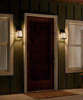 Tolerand 12 Inch Outdoor Wall Light in Textured Black with Clear Seeded Glass on porch, nighttime glow, weather resistant