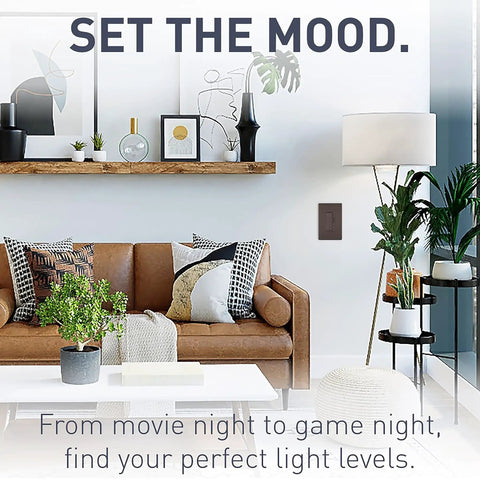 Radiant 450W Preset Decorator Rocker Dimmer Switch with LED Locator on wall, home living room view, dark bronze finish.