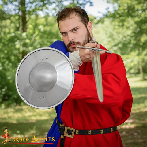 Man holding Old School Medieval Steel Buckler Shield Handcrafted With Wooden Grip, 16 Gauge, 30 Cm Round for LARP or Reenactment