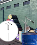 Heavy Duty Manual Oil Drum Pump With Ergonomic Handle for High Pressure Transfer mounted on a blue oil drum in an outdoor setting.