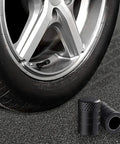 Black Anodized Tire Valve Stem Caps, 10 Pack, Corrosion Resistant Aluminum Valve Covers For Cars, Trucks, SUVs, Motorcycles And Bikes shown on a tire.