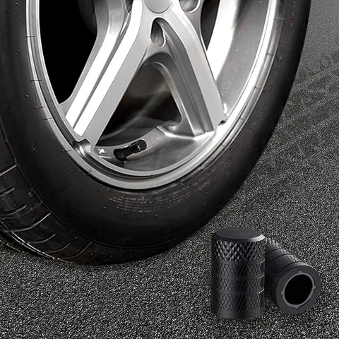 Black Anodized Tire Valve Stem Caps, 10 Pack, Corrosion Resistant Aluminum Valve Covers For Cars, Trucks, SUVs, Motorcycles And Bikes shown on a tire.