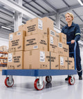 Heavy Duty Five Inch Industrial Grade Caster Wheels With Total Locking Brakes Smooth Rolling Set Of Four 2204 Pound Capacity For Shop Carts And Tool Chests on a cart with boxes in a warehouse.