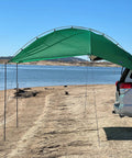 SUV Sport Multi Use Outdoor Shade Shelter Tent Camping Awning With Three Poles Two Legs And Carry Bag Ideal For Tailgates Beach Trips And Backcountry Expeditions Jolly Green attached to car at lakeside