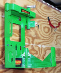 Mounted green metal bracket for securing Two Pack Xtreme Pro Series backpack leaf blower BPS100 for easy yard cleanup in trailers.