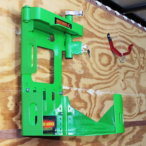 Mounted green metal bracket for securing Two Pack Xtreme Pro Series backpack leaf blower BPS100 for easy yard cleanup in trailers.