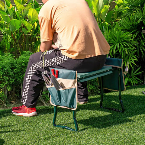 Man sitting on Foldable Garden Kneeler And Seat With 8 Inch Wide EVA Foam Pad, Heavy Duty Garden Stool With Two Big Tool Pouches in garden.