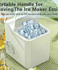 Electric Countertop Ice Maker Featuring Self Cleaning Tech And Rapid Bullet Cube Production In Just Six Minutes With A Nifty 12 Kilogram Daily Output That Slams On Any Counter Comes Packed With A Scoop And Basket For Dope Home Bartending Sessions - Portable handle for easy movement with ice cubes visible.
