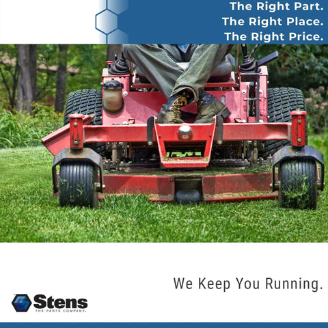 Man operating red riding lawn mower cutting grass