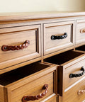 Wooden dresser with braided cognac leather drawer pulls, 6-1/2 x 1 inch, from Leather Drawer Pulls Braided Cognac Finish Set Of 12.