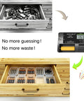 Straight Shooting Battery Tester For AA AAA C D And 9V Household Cells With Precise Digital Voltage Readings showing battery organization in a wooden drawer.