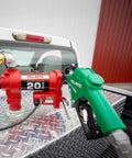 Heavy Duty 12V Fuel Transfer Pump With 20 GPM Flow Rate Cast Iron Construction Auto Shut Off Nozzle And Swivel Discharge Hose For Diesel Gasoline Kerosene And Biofuel Blends Built Like A Tank mounted on truck bed.