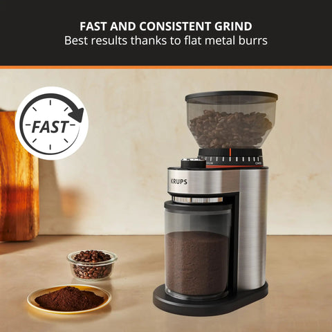 Game Changer Flat Burr Coffee Grinder delivering eighteen precision grind options, stainless steel with coffee grounds visible.