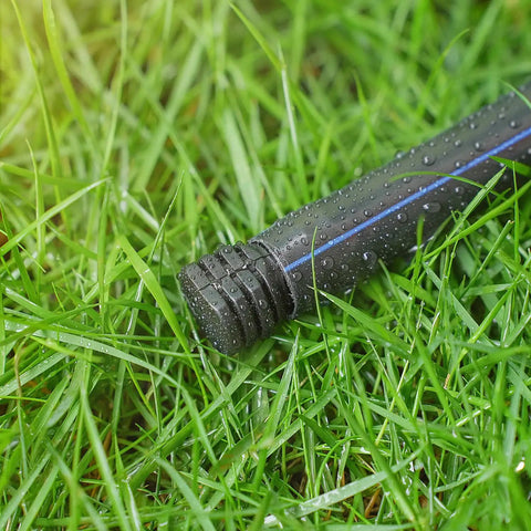 DIY Ready 1/2 Inch Drip Irrigation End Cap Kit with 15 Barbed End Plugs for 1/2 Inch Tubing on grass