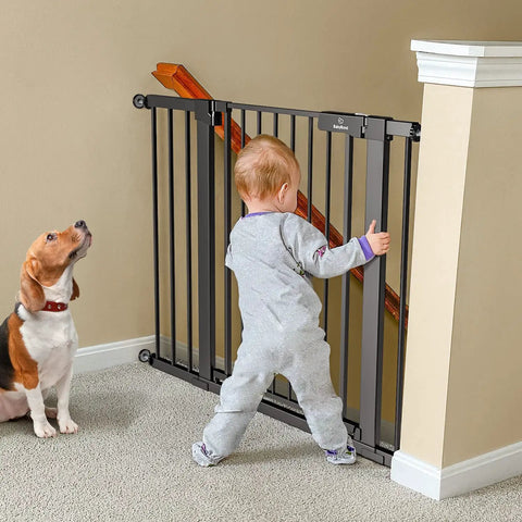 Child and dog near Extra Wide Baby Gate For Stairs And Doorways Fits 27 To 43 Inches With Walk Through 21 Inch Opening 30 Inch Tall Auto Close