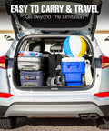 Car trunk loaded with luggage, cooler, and beach wagon with big sand wheels, ready for camping and outdoor adventures.