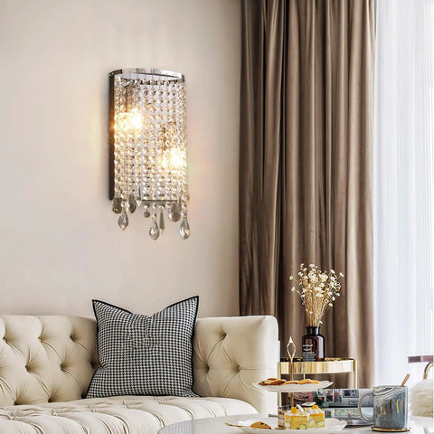Modern Crystal Wall Sconce With Sparkling Crystal Drops Shade For Living Room Hallway And Bedroom Luxe Chrome Finish Premium K9 Crystal Beads Sleek Ambient Lighting For Home Or Hotel Decor in elegant living room setting