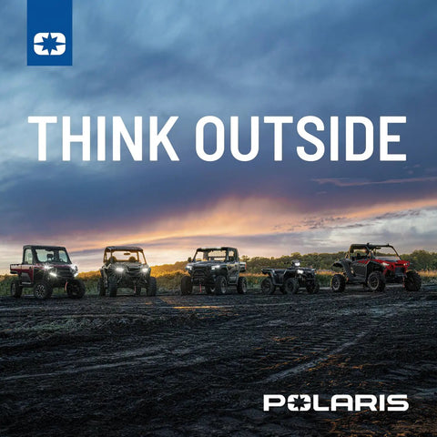 Group of Polaris RZR vehicles on a trail at sunset, showcasing outdoor adventure and rugged terrain.