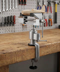 3 Inch Table Vise With Swivel And 360 Degree Tilt holding a wooden model airplane on a workbench with tools in background