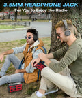 Two men using Emergency Radio With NOAA Weather Radio And AM FM Bands 10000mAh Power Bank USB Solar And Hand Crank Charging outdoors
