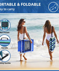 Two women carrying 3-In-1 Beach Chair With Face Holes And Folding Side Table Outdoor Lounger on beach, showing net pocket and handle.