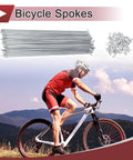 Man cycling with 48 Piece Set 10G Bicycle Spokes 260mm For Road And Mountain Bikes Carbon Steel Galvanized Silver Tone