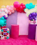 Doggo Approved Paw Print Party Balloon Kit With Pink Teal Purple Hot Pink Paw Print Balloons And Bone Foil Balloon For Girls Puppy Themed Birthday Or Baby Shower Decor in colorful setup with balloon arch and pedestals.
