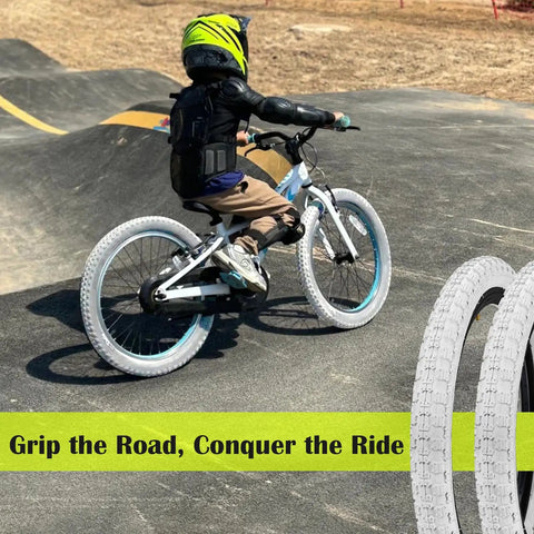 Child biking with Two Pack Kids BMX Bike Tires 12.5 Inch By 2.125 Inch Replacement Set, showcasing kid-friendly grip on track.