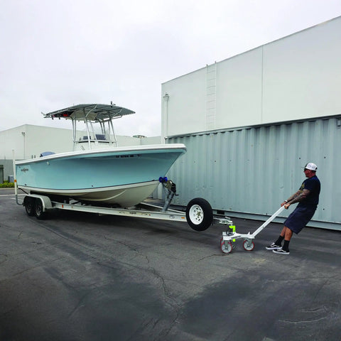 Heavy Duty Trailer Tug Man Moves Rv And Boat Trailers Up To 20K Lbs Capacity With 3500 Lb Tongue Weight Max. Boat on trailer being maneuvered.